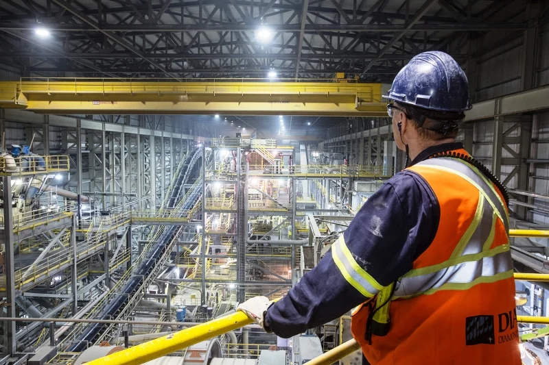 Engineer looking across the machinery inside a processing plant